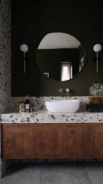 Ca’ Pietra on Instagram: "The bathroom the internet is going CRAZY about 😲 Combining our Rialto San Polo terrazzo, Foundry Smeraldo tiles and Brit Stone Pennant flooring for the coolest vibe 🤌 a work of art by @thetapend.design for @homeatpriory 🤍  Video clips @adamcarterphoto   #homegoals #bathroomgoals #interiordesigninspo #interiordesign #tileideas #interiordecor #floortiles #bathroomsofinstagram #tilingwork #tileideas" Bathroom Interior Design Terrazzo, Terrazzo Floor Bathroom, Black Terrazzo Floor, Terrazzo Bathroom Design, Dark Tile Bathroom, Ca Pietra, Terrazzo Countertop, Terrazzo Bathroom, Black Terrazzo