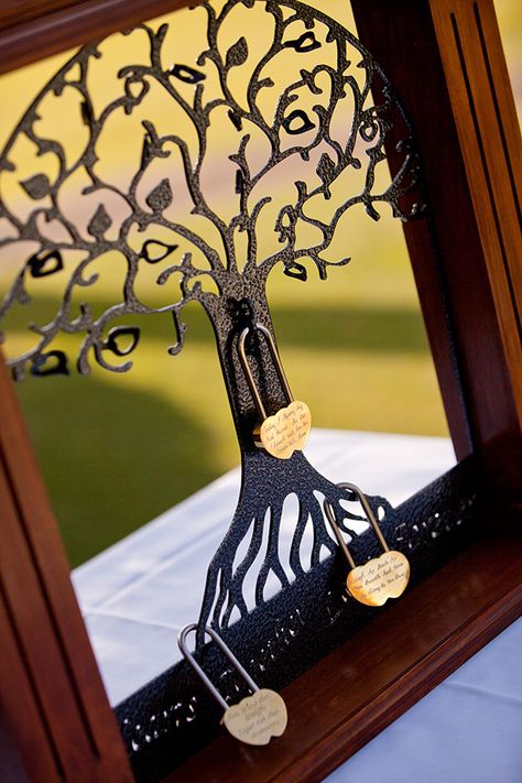 The Tree of Life is a unique way to “lock your love” at a wedding ceremony. Each love lock can have a personal message engraved and guests are welcome to add locks also. - See more at: http://www.easyweddings.com.au/real-weddings/danielle-tarrant-close-the-gap-at-their-elegant-vintage-wedding/#sthash.R02w0Yoj.dpuf Love Locks Wedding Ceremony, Love Lock Tree Unity Ceremony, Love Lock Ceremony, Vintage Wedding Decorations Elegant, Unity Candle Flower Arrangement, Boda Vintage Ideas, Unity Ideas, Wedding Ceremony Unity, Ceremony Candles