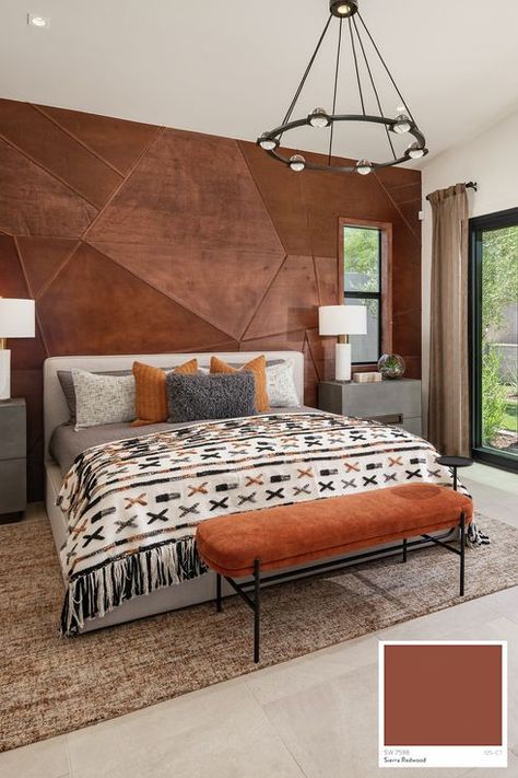 Modern Guest Casita bedroom designed with a unique accent wall and access to a private patio. Accent Wall Interior Paint Color: Sierra Redwood interior paint color by Sherwin-Williams. Southwest Guest Bedroom, Spanish Accent Wall, Leather Accent Wall, Southwest Master Suite, Rust Accent Wall Bedroom, Terra Cotta Accent Wall Bedroom, Rust Color Accent Wall, Modern Organic Accent Wall, Tile Accent Wall Bedroom