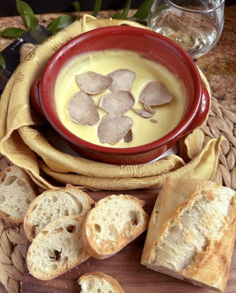 Truffle fondue, or fonduta al tartufo in Italian, is a rich and decadent dish made with Fontina cheese, and topped with fresh truffles. Tartufo Recipe, Italian Truffles, Fondue Recipe, Baked Camembert, Fontina Cheese, Fondue Recipes, Fondue Pot, Italian Cheese, Milk And Cheese