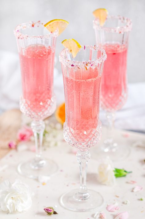 Sparkling Raspberry Rose Spritzer - Enjoy cocktail hour sipping a glass of pink bubbly with a hint of raspberry and floral flavor. Perfect for Valentine's Day! From aberdeenskitchen.com #sparkling #raspberry #rose #spritzer #cocktail #beverage #happyhour #datenight #valentinesday Pink Bubbly Drink, Vday Breakfast, Rose Spritzer, Fruit Business, Rose Drink, Cocktail Rose, Coffee Milkshake, Sparkling Cocktail, Rose Cocktail