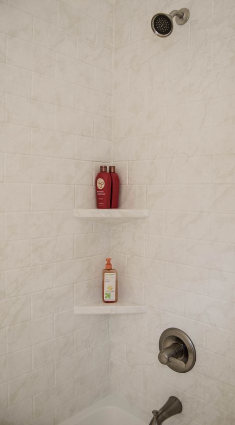 This built in corner shelf makes finding and using toiletries easy!   Plus who doesn't love new tile! Corner Shelf Tile Shower, Bath Corner Shelf, Shower Toe Shelf, Shower Shelf Corner, Tile Shelves In Shower Built Ins, Tiled Shower Shelf, Shower Floating Shelf, Corner Shelf In Shower, Tile Corner Shelf