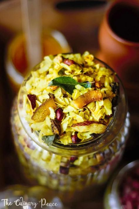 Close up of Poh Chivda in a jar and in a bowl. Poha Chivda, Indian Vegan, Dried Coconut, Raw Peanuts, Coconut Desserts, Dry Coconut, Coconut Milk Curry, Traditional Recipes, Dry Snacks