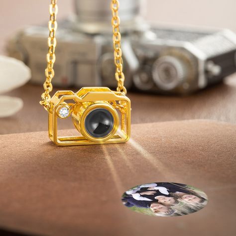 [DELICATE DESIGN]: This necklace with a camera charm pendant and is available in silver, gold, and rose gold. The pendant is inlaid with a projection stone and can engrave any photo in the middle of the projection stone. Put the photo inside the camera pendant when they see the photo, they will remind of the good times. This tiny camera pendant is delicate and simple, perfect for stacking or layering with other jewelry.  [MATERIAL]: The customized photo projection necklace is made of high-qualit Photo Projection Necklace, Camera Charm, Tiny Camera, Projection Necklace, Photographer Gifts, Jewelry Accessories Ideas, Jewelry Lookbook, Delicate Design, Fancy Jewelry