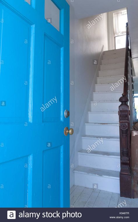 Download this stock image: A staircase facing a front door, which is considered to be bad feng shui because good energy escapes right out the entrance. - K946TR from Alamy's library of millions of high resolution stock photos, illustrations and vectors. Bad Feng Shui, Good Energy, Feng Shui, Locker Storage, Front Door, Entrance, Photo Image, High Resolution, Stock Images