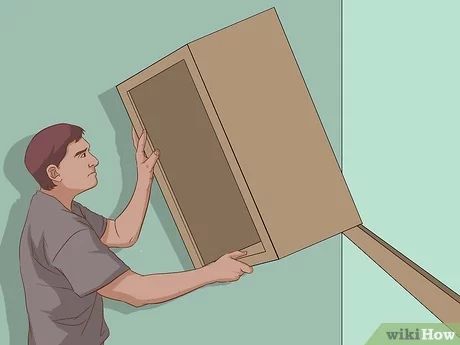 How To Hang Upper Kitchen Cabinets, How To Install Wall Cabinets, Mounting Cabinet To Wall, How To Hang A Cabinet On A Wall, How To Mount Cabinets On Wall, How To Hang Wall Cabinets, How To Hang Cabinets Laundry Rooms, Hanging Cabinets Kitchen, How To Hang Cabinets