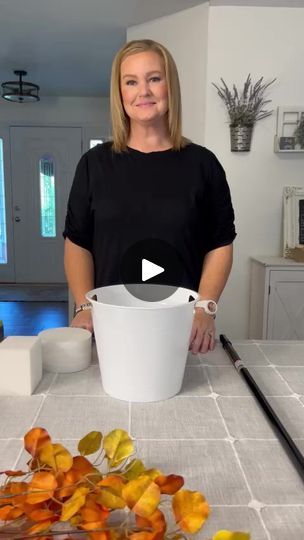 1.8M views · 53K reactions | 🎨✨ Transform your space with this DIY dupe for the $329 Pottery Barn eucalyptus tree! 🌿 Grab a Dollar Tree bucket, foam pieces, a couple of bags of rocks.,a broom handle, masking tape, and some brown and black paint! Don’t forget a paintbrush and a cute basket if you have them! 🪣🖌️🪨Get creative and make your own stunning eucalyptus tree without breaking the bank. Share your awesome creations with us—can’t wait to see what you come up with! 😍🎉 #DIYMagic #EucalyptusTree #CraftyDIY #BudgetFriendly #dollartree #dollartreefinds #spookyseason #falldecor | Crafting By The Bay | Crafting By The Bay · Original audio Fall Decor Ideas For The Office, Paint Bucket Ideas, Bucket Decorating Ideas, Crafts 2024, Fall Dec, Cute Basket, Bucket Ideas, Easy Diy Halloween Decorations, Dollar Tree Fall