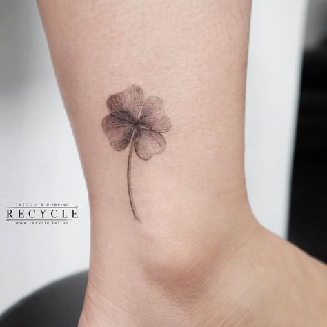 Small Black Flower Ankle Tattoo Minimalist 4 Leaf Clover Tattoo, Lightning Flower Tattoo, Four Leaf Clover Tattoo Black And White, Four Clover Tattoo, Clover Ankle Tattoo, Purple Clover Tattoo, Small Black Tattoo For Women, Ireland Tattoo Ideas Small, Behind Ankle Tattoo