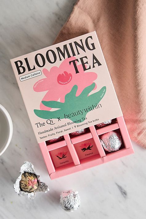 Sweet and fruity, this artisanal blooming tea is made from a harmonious blend of green tea, large peony blooms, and vibrant globe amaranth. Each tea truffle infuses your cup with a symphony of flavors, colors, and aromas. The peony is a sign of abundance and expansion. Together with green tea and amaranth, it’s packed with antioxidants to help fight inflammation, improve brain function, promote heart health and digestive health, and attain balance for that inner and outer glow. Brewing instructi Box Design Creative, Amaranth Flower, Packaging Box Design, Tea Packaging Design, Globe Amaranth, Blooming Tea, Improve Brain Function, Flower Store, Tea Brands