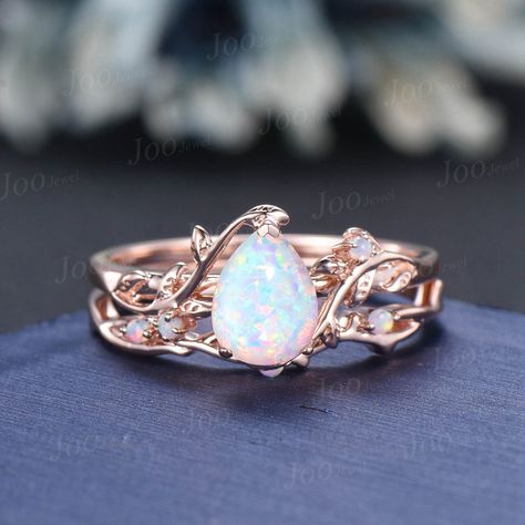 Nature Inspired  Jewelry, Twig Opal Ring Set , 10K Rose Gold, Hexagon Cut Ring, Branch Engagement Ring, opal Wedding Ring , October Birthstone, Birthday Gifts Main Ring : 6*8mm pear cut Lab white opal. Side stone : lab created opal Matching Band: lab created opal Material Metal: 925 sterling silver, Solid 14k/18k gold, platinum PLEASE choose silver or platinum if you are allergic to nickel. This jewelry is made to order, it can be made with any gemstone/metals. 2-3 weeks to finish. Default Shipp Wedding Ring Opal, Birthstone Wedding Ring, Opal Wedding Ring Set, Opal Wedding Ring, Cute Promise Rings, Branch Engagement Ring, Pink Opal Ring, Heart Wedding Rings, Unique Opal