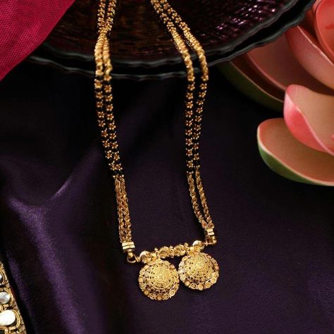 Malabar Gold Jewellery #GoldJewelleryBangles #GoldJewelleryUnique Malabar Gold Jewellery, Mangalsutra Traditional, Temple Jewellery Designs, Mangalsutra Designs Gold, Traditional Mangalsutra, Thali Chain, Mangalsutra Chain, Mangalsutra Design, Black Beads Mangalsutra