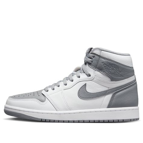 The Air Jordan 1 Retro High OG Stealth is one of the most iconic versions of the ever-popular Air Jordan 1. This sneaker features a sophisticated stealth grey hue over its laces, overlays, leather tongue labels, Swoosh logos and outsole. Combined with a white colorway on the shoe’s goat leather base and perforated toe box to allow aeration, this high quality shoe is perfect for any style. Its outsole is also patterned to provide superior traction which ensures you look great while still performi Logo Wings, Grey Jordans, Retro Basketball Shoes, Nike Snkrs, White Shoes Sneakers, Jordan 1 High Og, Air Jordan 1 Retro High Og, Air Jordan 1 Retro High, Air Jordan 1 High