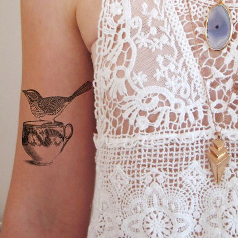 Designer Wilma Boekholt (of Tattoorary) creates temporary tattoos, but with an old school twist. In February 2014, the artist felt that there was a need for temporary tattoos with a distinctly authentic look. Though she absolutely loves tattoos, Boekholt isn't the type to commit long-term, which is why she was mainly interested in a piece of art that isn't permanent. Since that time, the designer has worked to build Tattoorary, a store showcasing vintage, floral, and even Delfts Blauw tattoo... Tea Cup Tattoo, Turtle Project, Tea Tattoo, Teacup Tattoo, Cup Tattoo, Yellow Canary, Vintage Tea Cup, Beautiful Tattoo, Temp Tattoo