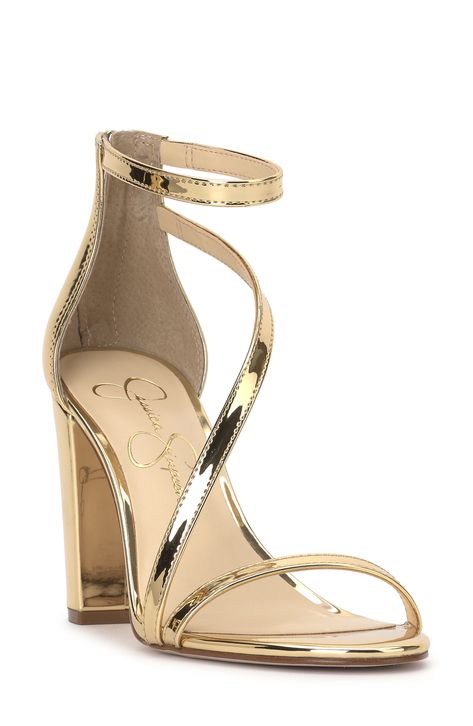 An asymmetric vamp strap creates modern dimension on a trend-savvy sandal lofted by a wrapped block heel. 3 1/2" heel Textile upper/synthetic lining/rubber sole Imported Gold Metallic Shoes, Heels For Gold Dress, Homecoming Shoes Gold, Elegant Gold Heels, Sweet Sixteen Shoes, Gold Hoco Shoes, White Gold Heels, Light Gold Heels, Prom Shoes Ideas