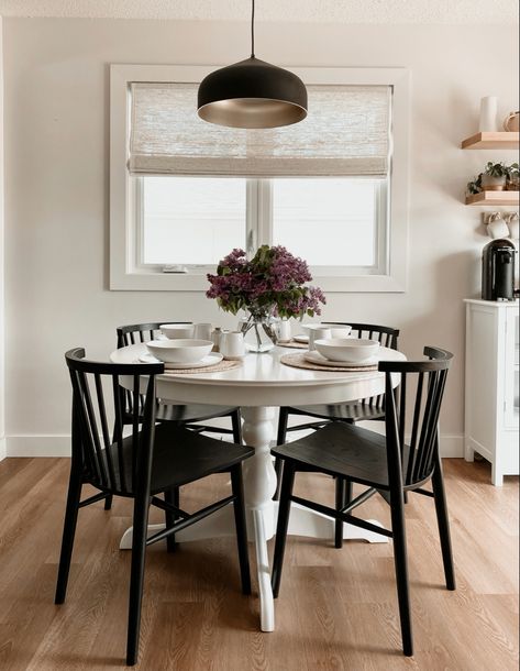 Small dining room ideas, round white table with black chairs. Round Dining Table Dinner Set Up, White Circular Dining Table, Ikea Dining Chairs White, Black Dining Room Table Circle, White Dinning Room Table Black Chairs, Black Dining Chairs Round Table, White Round Table With Black Chairs, Black Tulip Table Dining Room, Black And White Eat In Kitchen