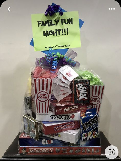 Games Gift Basket Ideas, Cornhole Raffle Basket, What To Put In A Movie Night Gift Basket, Family Fun Auction Basket Ideas, Family Game Gift Basket Ideas, Board Games Basket Ideas, Family Night Raffle Basket Ideas, Diy Family Game Night Gift Basket, Family Game Night Raffle Basket Ideas