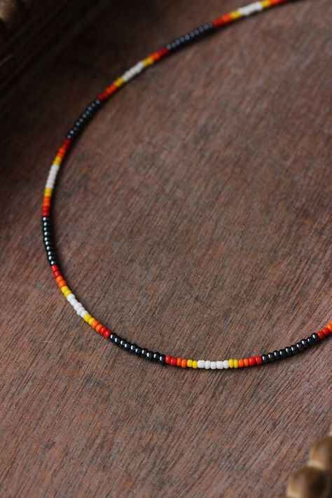 Dainty multicolored boho necklace with black hematite color,white,red,orange,yellow seed beads,silver tone clasps, strong nylon double thread, silver tone lobster claw and steel adjustable length chain. Perfect summer beach jewelry for everyday and a great gift! The length of chain is about 44 cm or 17.3 inches and 3.5 cm of adjustable length chain. Other necklaces of my shop you can see here: https://www.etsy.com/shop/NaTavelli?section_id=14843046&ref=shopsection_leftnav_5 Thanks for a visit Seed Bead Necklace Men, Seas Bead Necklace, Beach Seed Bead Necklace, Orange Seed Bead Necklace, Black Seed Bead Necklace, Western Seed Bead Necklace, Seed Beads Ideas, Western Beaded Jewelry, Sea Bead Necklace