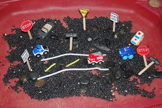 "Busy Street" Sensory Tub - black beans, rocks, cars, road signs, white and yellow pipecleaners for roads Community Helpers Sensory, Intentional Teaching, Creative Curriculum Preschool, Sensory Tables, Abc Centers, Table Activities, Sensory Tubs, Sensory Tub, Community Helpers Theme