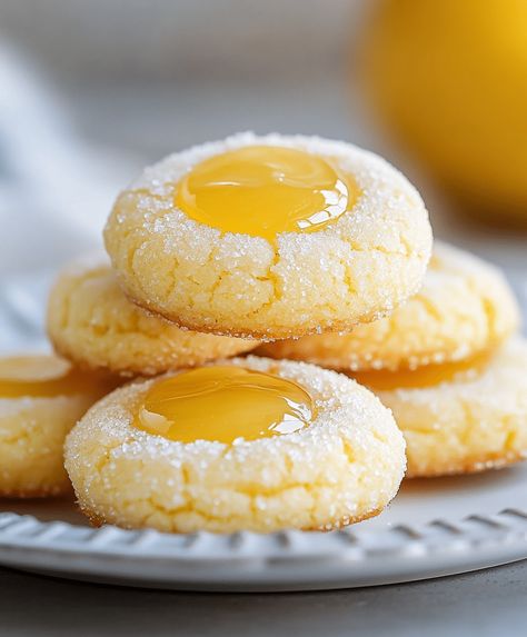 Buttery lemon thumbprint cookies with tangy lemon curd filling, perfect for tea-time or as a sweet treat, easy to bake! Lemon Curd Thumbprint Cookies Recipe, Italian Lemon Curd Filled Cookies, Lemon Custard Cookies, Lemon Curd Thumbprint Cookies, Lemon Filled Cookies, Stuffed Lemon Cookies, Lemon Thumbprint Cookies, Lemon Curd Cookies, Custard Cookies