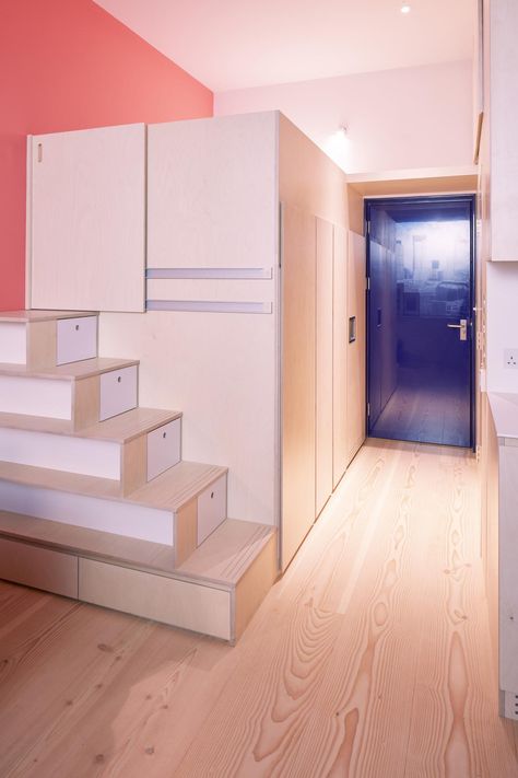 The budget micro-flat of the future: stairs double up as drawers (but there’s plenty of room for a bed) | London Evening Standard | Evening Standard Micro Flat, Traditional Apartment, Douglas Fir Flooring, Prefab Houses, Plasterboard Wall, Micro Apartment, Real Wood Floors, Corner Sink, Illuminated Mirrors