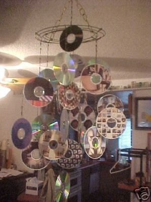 cd mobile Hanging Cds, Cd Chandelier, Reggio Hanging Decor, Spiral Mobile Diy, Reggio Emilia Chandelier, Reggio Chandeliers, Infant Education, Vinyl Record Wind Chime, Sensory Area