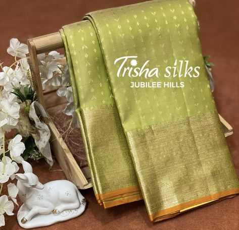 This Pastel Green Colour Kanchipuram silk saree in tiny zari butta all over the body an contrast orange blouse an edge piping. Store Address : 36 Jubilee Hills, Beside KIA Motors, Hyderabad - 500033. #silksaree #kanchipuramsaree #traditional #weddingcollection #sareelove #ikkatsarees #patolasaree #handwoven Kia Motors, Orange Blouse, Kanchipuram Silk Saree, Kanchipuram Saree, Green Colour, Pastel Green, Hyderabad, Silk Saree, Piping