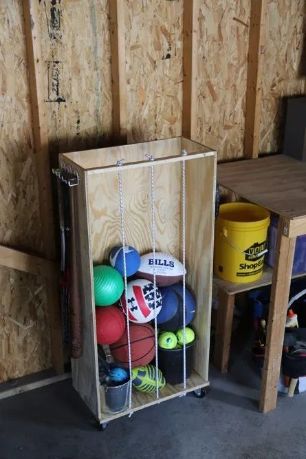 Solving the Sports Equipment Storage Dilemma – haus2home Diy Outdoor Toys, Outdoor Toy Storage, Sports Equipment Storage, Gaming Aesthetic, Sports Storage, Workbench Plans Diy, Toys Ideas, Ball Storage, Garden Tool Storage