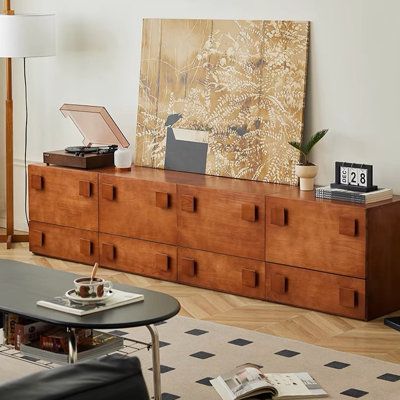 Unleash your creativity and redefine your living space with our Modular Wooden TV Console—a versatile masterpiece that adapts to your every whim. Here's why it's the epitome of customizable elegance: | Latitude Run® Shavada TV stands Brown 91.32 x 15.74 in, Wood | C110806444_456456382 | Wayfair Canada 70s Media Console, Transitional Furniture Style, Tv Above Credenza, Eclectic Living Room Tv Wall, Bookshelf Tv Console, Indonesian Furniture Bali Living Rooms, Retro Console Table, Montreal Interior Design, Unique Media Console