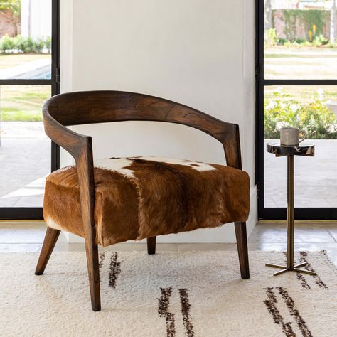 Reclaimed fossilized oak is given new life and a modern look. Handcarved, polished and accented with metal detailing for a subtle mix of warmth, texture and contrast. Cowhide Chairs, Modern Mountain Cabin, Western Chair, Preppy Cowgirl, Ski Condo, Cowhide Chair, Maggie Valley, Round End Table, Mountain Modern