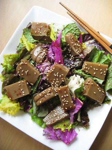 Here's some dotorimuk (acorn jelly) salad that I enjoyed today. Dotorimuk is popular in Korea and it's generally thought of as a 'diet food' since it's low in calories. It's not exactly full of nutrition though, so I make sure to include lots of healthy greens to compensate!For the dressing, I just used what I had on hand:1Tbs soy sauce1 Tbs water1/2 tsp sesame seed oil1/2 tsp red pepper flakessesame seeds sprinkled on topI just mixed all the ingredients together, poured it over the salad, and t Korea Cucumber Salad, Acorn Jelly Korean, Acorn Jelly, Seaweed Salad Aesthetic, Jelly Salad, Healthy Greens, Sesame Seed, Korean Dishes, Enjoy Today