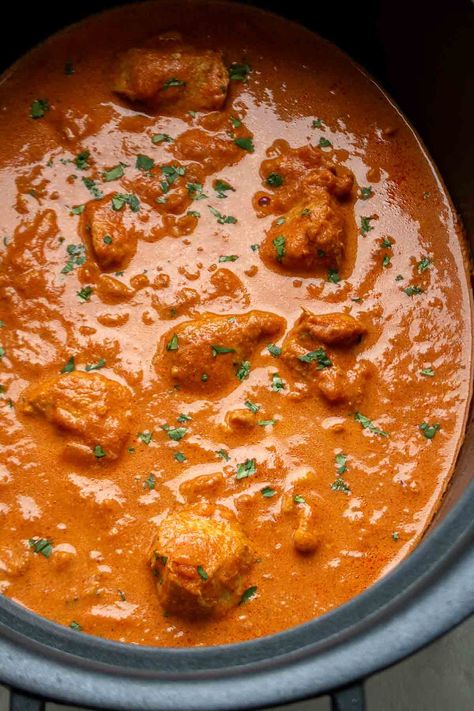 Made with chicken thighs, spices, tomatoes, and heavy cream, this slow-cooker butter chicken recipe is easy to make and full of flavor. Chicken Thigh Indian Recipes, Slow Cooker Chicken Thighs Recipes, Chicken Thigh Recipes Slow Cooker, Chicken Thigh Slow Cooker Recipes, Chicken Thigh Slow Cooker, Chicken Thighs Slow Cooker, Chicken Thighs Crockpot, Chicken Thighs Slow Cooker Recipes, Crockpot Butter Chicken