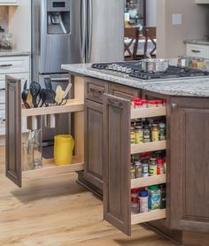 Multiple cabinet accessories were integrated into the #kitchen #remodel to fit their needs. A Utensil #Storage Pull-Out was utilized to store spatulas and cooking utensils to one side of the range, while a Spice Rack Pull-Out was selected for the other. The combination was the perfect solution for keeping their most-used cooking supplies near the cook’s fingertips. Read more on the Dura Supreme #Cabinetry Blog. Utensil Storage Drawer, Kitchen Storage Organization Diy, Diy Kitchen Accessories, Drawer Spice Rack, Kitchen Utensil Storage, Kitchen Redesign, Spice Racks, Diy Kitchen Storage, Spice Storage