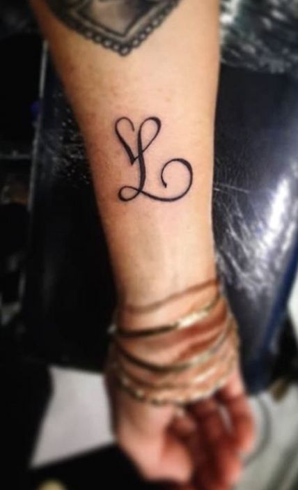 L With A Heart Tattoo, L Tattoo Letter Initial, Cursive L Tattoo With Heart, Letter L Tattoo Small, L Tatoos Initial, Double L Tattoo, Initial L Tattoo, L Letter Tattoo Design, L Tattoos For Women