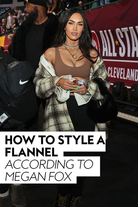 She cheered on Machine Gun Kelly from the stands during the NBA All-Star Celebrity Game, rocking a flannel off-the-shoulder. #celebrity #hollywood How To Style A Flannel, Styling A Flannel, Leggings And Combat Boots, Celebrity Game, Conservative Outfits, Chic Purses, Black Leggings Outfit, H.e.r Aesthetic, Long Dark Hair