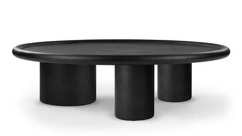 The Farro Coffee Table features a matte black finish with wood grain detailing, creating a bold and dark appearance. Its circular top has a rounded lip on the edge, and the table stands on asymmetrically sized tubular legs, with one leg wider than the others. The chunky proportions and rounded shapes contribute to its fun design, and adds a visual softness to your interior.This coffee table is not only functional, providing generous space for placing items, but is also a stylish addition to any Coffee Table Black, Tripod Table, Table Black, Fun Design, On The Edge, Black Interior, The Edge, Wood Grain, Matte Black