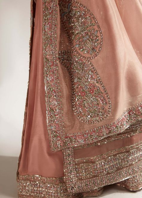 VERVE by Hussain Rehar. This regal outfit rendered in a beautiful shade of Pink on an organza canvas for shirt and Raw-silk palazzo, with heavy embellished motifs along with intricate details. The timeless look is completed with an organza dupatta along with four side heavy embellished borders with 3 different corner motifs embellished with sequins, cut dana and with nakashi, dabka concluding the look marvelously. Colour: Dusty Pink Fabric Details: Shirt: Organza Palazzo: Raw silk Dupatta: ... Organza Palazzo, Dusty Pink Fabric, Dusty Pink Dress, Hussain Rehar, Dana Dress, Pakistani Bridal Lehenga, Wedding Dresses Pakistani, Bridal Mehndi Dresses, Pakistani Bridal Dress