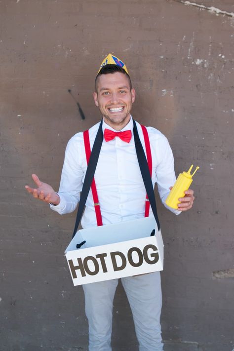 easy tutorial for family halloween costume. Create this family-friendly costume with dad as a hot dog seller and baby as a hot dog! Such an easy and affordable Halloween costume! #costume #familycostume #halloween #halloweencostume Concession Stand Costume Ideas, Corn Dog Halloween Costume, Hot Dog Stand Trunk Or Treat, Diy Hot Dog Costume For Dogs, Hot Dog Vendor Costume, Hot Dog Halloween Costume, Hot Dog Costume, Affordable Halloween Costumes, Hotdog Costume