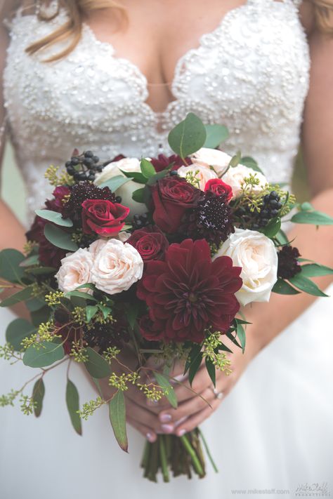 Maroon and ivory bouquet.  Fun and creative Michigan wedding and engagement photographers with realistic prices. Award-winning photojournalistic, contemporary and traditional wedding photographers. #DetroitWedding #MikeStaffProductions #WeddingPlanning #WeddingDetails #WeddingBudget #MichiganWedding Burgundy And White Flower Centerpieces, Burgundy And Ivory Bouquet, Burgandy Wedding Boquet, Moody Wedding Bouquets, Maroon Flowers Bouquet, Wedding Bouquets Maroon, Engagement Flowers Bouquet, Maroon Wedding Flowers, Wedding Flowers Maroon