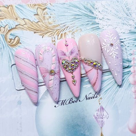 Long stiletto Pastel pink and lilac nais with crystal heart crystals and snowflakes. cute pink nails. pink press on nails Pink Nutcracker Nails, Sugarplum Nails, Winter Nails Stiletto, Christmas Nail Designs Pink, Pink Nails Christmas, Pastel Christmas Nails, Christmas Nails Pink, Pink Winter Nails, Cozy Nails