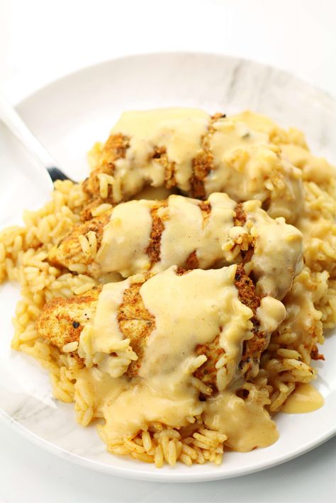 Instant Pot Mexican Queso Chicken and Rice--flavorful, tender and moist chicken on top of seasoned rice and drizzled with a cheese sauce. Chicken Rice And Queso, Rice And Queso, Queso Chicken And Rice, Protein Queso, Mexican Chicken Rice, Mexican Queso, Queso Chicken, Mexican Chicken And Rice, Boiled Chicken Breast