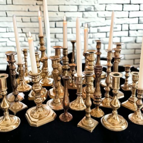 Enhance your holiday tablescape with our Eclectic Vintage Brass Candlestick Collection. Choose from a variety of mismatched pairs or opt for a symmetrical set of two. Each candlestick is steeped in history, offering unique shapes and patinas, from bright to deep tarnish, adding an air of curated elegance to your festive gatherings. Perfect for those who appreciate the beauty of vintage decor. The images shown are a window into the vast array of styles you can expect. Your selected pieces, while Eclectic Engagement Party, Wedding Decor Eclectic, Fall Wedding Plates Table Settings, Mismatched Place Settings, Whimsical Wedding Tablescape, Wedding Centerpieces Candlesticks, Elegant Vintage Wedding Decor, Vintage Boho Wedding Decor, Vintage Glam Wedding Decor