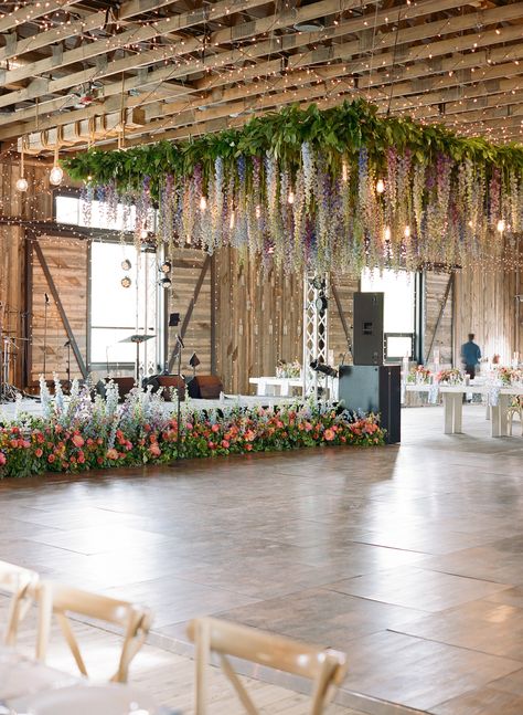 Blue, lavender, purple, pink delphinium ceiling installation chandelier Wedding Ceiling Installation, Wisteria Ceiling Wedding, Wisteria Ceiling, Ceiling Installation Wedding, Ceiling Floral Installation, Blue Delphinium Wedding, Hanging Delphinium Wedding, Floral Roof Installation Wedding, Dance Floor Flower Installation