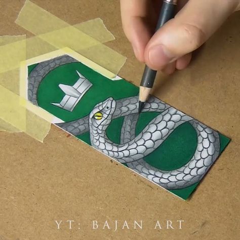 Łukasz Andrzejczak ♊ no Instagram: “Timelapse of the Slytherin 🐍bookmark. Watch till end ✏ If you like it double tap please and tag your potterhead friends. I will be very…” Slytherin Bookmark, How To Make Bookmarks, Double Tap, Funko Pop, No Instagram, Tap, Harry Potter, Doodles, Tags