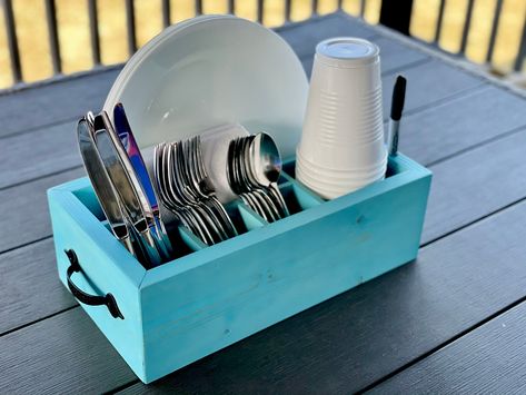 "Stop your search! You've found the perfect picnic caddy! This utensil caddy holds every essential item for your bbq, picnic, party, or dinner in a small, compact footprint! This will impress your guests and last for many, many years of entertaining. ✔Fork, Spoon and Knife Slots ✔Napkin Holder ✔Full Size Plate Compartment ✔16oz Solo Cup Holder with Sharpie Marker Hole At a full 4.5\" tall, there is plenty of depth to easily hold all of your silverware, napkins, plates and cups upright. You can c Picnic Caddy, Solo Cup Holder, Caddy Diy, Silverware Caddy, Plates And Cups, Bbq Picnic, Utensil Caddy, Solo Cup, Wood Utensils