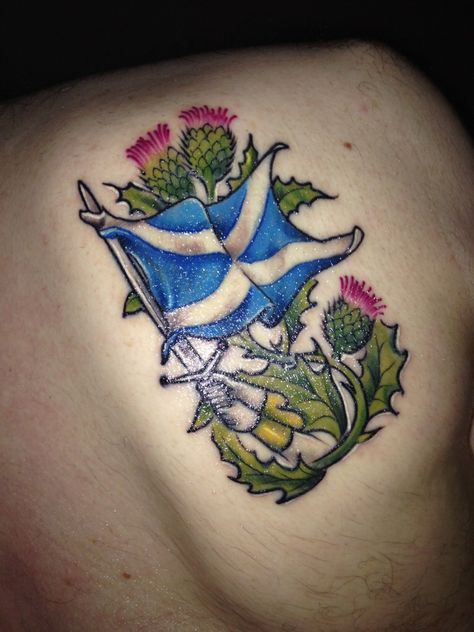 Thistle sword scottish tattoo Scottish Thistle Tattoo Watercolor, Scottish Flag Tattoo, Scottish Tattoos Men, Thistle Tattoos, Scotland Tattoo, Scottish Thistle Tattoo, Scottish Tattoo, Scottish Tattoos, Yellow Rose Tattoos