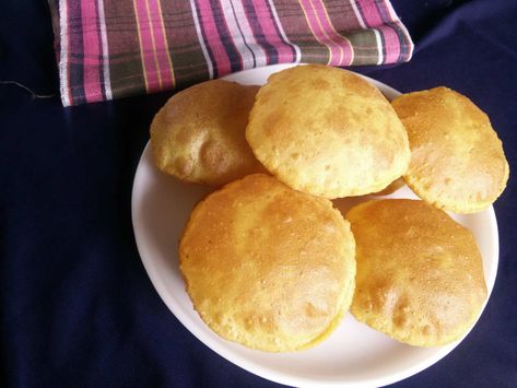 Makki Ki Puri is a great and wonderful deep fried Indian bread which can be served with almost any sabzi made with maize flour and wheat flour. It is very popular bread as everyone loves eating them.You will relish eating the Makki Ki Puri with side accompaniment of pickle, Aloo Dum and Tomato Onion Cucumber raita.If you like this recipe, you can also try other Puri recipesBihari Chana Dal Puri RecipeRajgira Puri RecipeAchari Masala Puri Recipe Masala Puri, Indian Bread Recipes, Aloo Paratha, Puri Recipe, Aloo Recipes, Indian Curries, Puri Recipes, Pulao Recipe, Indian Bread