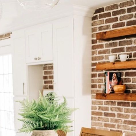 Intuitive Design | Interior + Spatial Design on Instagram: "An inviting kitchen filled with character, texture, and life! 

We added a brick wall to keep the charm and integrity of this historic home. We also created a custom coffee station to maximize functional storage. The styled, floating shelves tie it all together. 

Design: @intuitive.design_ 
🔨: @greateastern_contracting 
📸: @alexhdphoto 

#annapolisdesign #interiordesign #kitchenrenovation #annapoliskitchens #coffeestation #floatingshelves #twotonekitchen #winefridge #kitchenisland #brickwall #brickwallwaterfall 
@rqhouser @becobrien2" Floating Shelves On Brick Wall Kitchen, Floating Shelves On Brick Wall, Brick Wall Kitchen, Faux Brick Walls, Two Tone Kitchen, Faux Brick, Coffee Station, Functional Storage, Custom Coffee