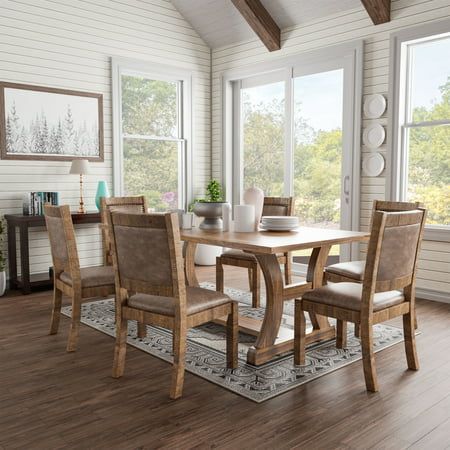 Add rustic charm to your modern farmhouse dining area with the seven-piece dining set, which features rustic pine wood construction. The dining table offers a spacious plank-style tabletop surface and rests on a trestle-style base with curved C-shaped legs and a center beam that lend an understated charm while providing ample support. Chairs feature light brown faux leather with classic nail head trims. About Furniture of America Furniture of America is proud to be the family friend that always has your back. We are more than just a business. Our customer care team is part of a larger FOA community dedicated to delivering a happy home. So browse our selection and invite warmth and character into every room in your home. Rustic Materials, Matching Chairs, Dine In, Table Frame, Dining Table Set, Furniture Of America, Large Table, Table Dimensions, Laurel Foundry Modern Farmhouse