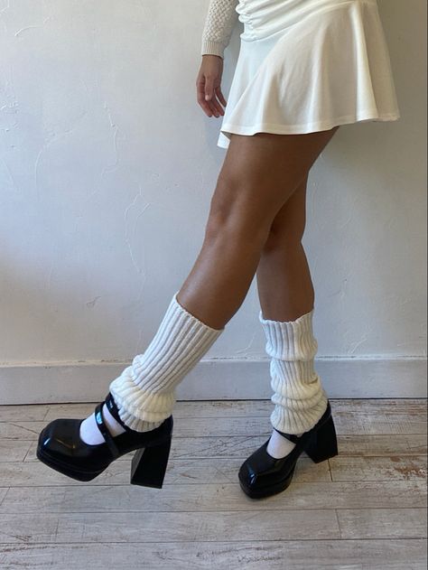 white leg warmers, white tennis skirt, black mary janes, neutral tones, black and white aesthetic Leg Warmer And Mary Janes, Mary Jane Shoes With Leg Warmers, Platform Shoes With Leg Warmers, Leg Warmers Knitted, Heels And Leg Warmers, Mary Janes Leg Warmers, Mary Janes With Leg Warmers, Leg Warmers With Heels, Leg Warmers And Heels