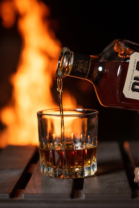 Nothing quite like a glass of bourbon by the fire! Join us in the wild. Whiskey Cowboy Aesthetic, Whiskey Bottle Photoshoot, Glass Of Whiskey Aesthetic, Bourbon Pictures, Bourbon Photoshoot, Bourbon Wallpaper, Bourbon Aesthetic, Bourbon Photography, Whiskey Aesthetic